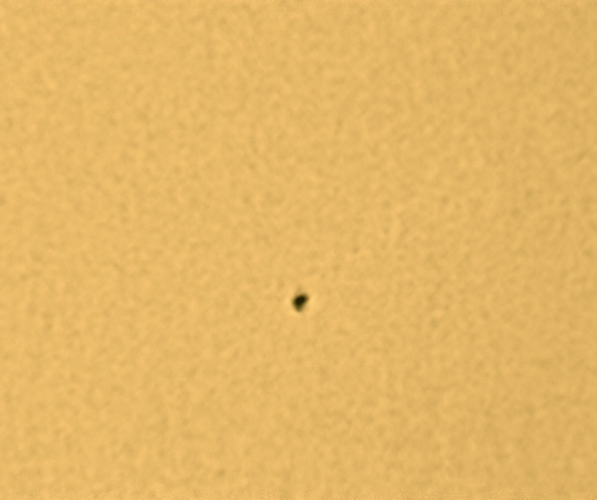 One of the small sunspots visible on during the first imaging session. Random surface patterns, called granules, are also barely visible