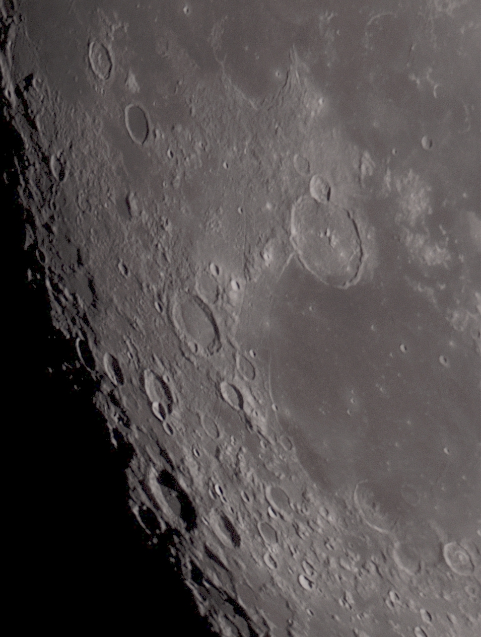 This image is looking across Mare Humorum toward the terminator (day/night border) in the south west. The shadows near the terminator make features appear more dramtic.