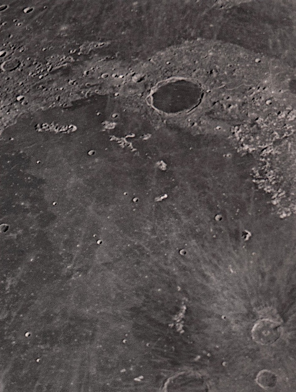 The northern part of Mare Imbrium, with the large crater Plato just above. The highlands to the southeast of Plato are known as the Montes Alpes.