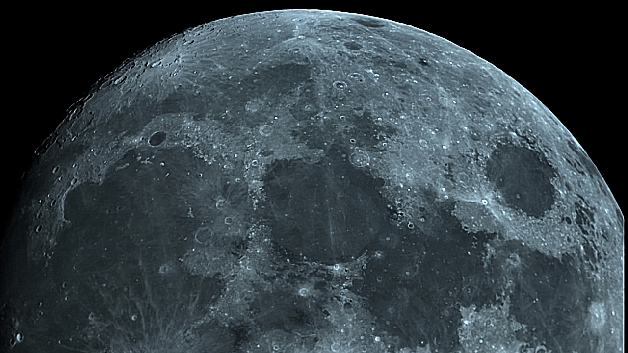 Northern hemisphere of waxing gibbous Moon. Prominent, from L to R, are Mare Imbrium, Mare Serenitatis, Mare Tranquilitatis, Mare Crisium, and Mare Fecunditatis.