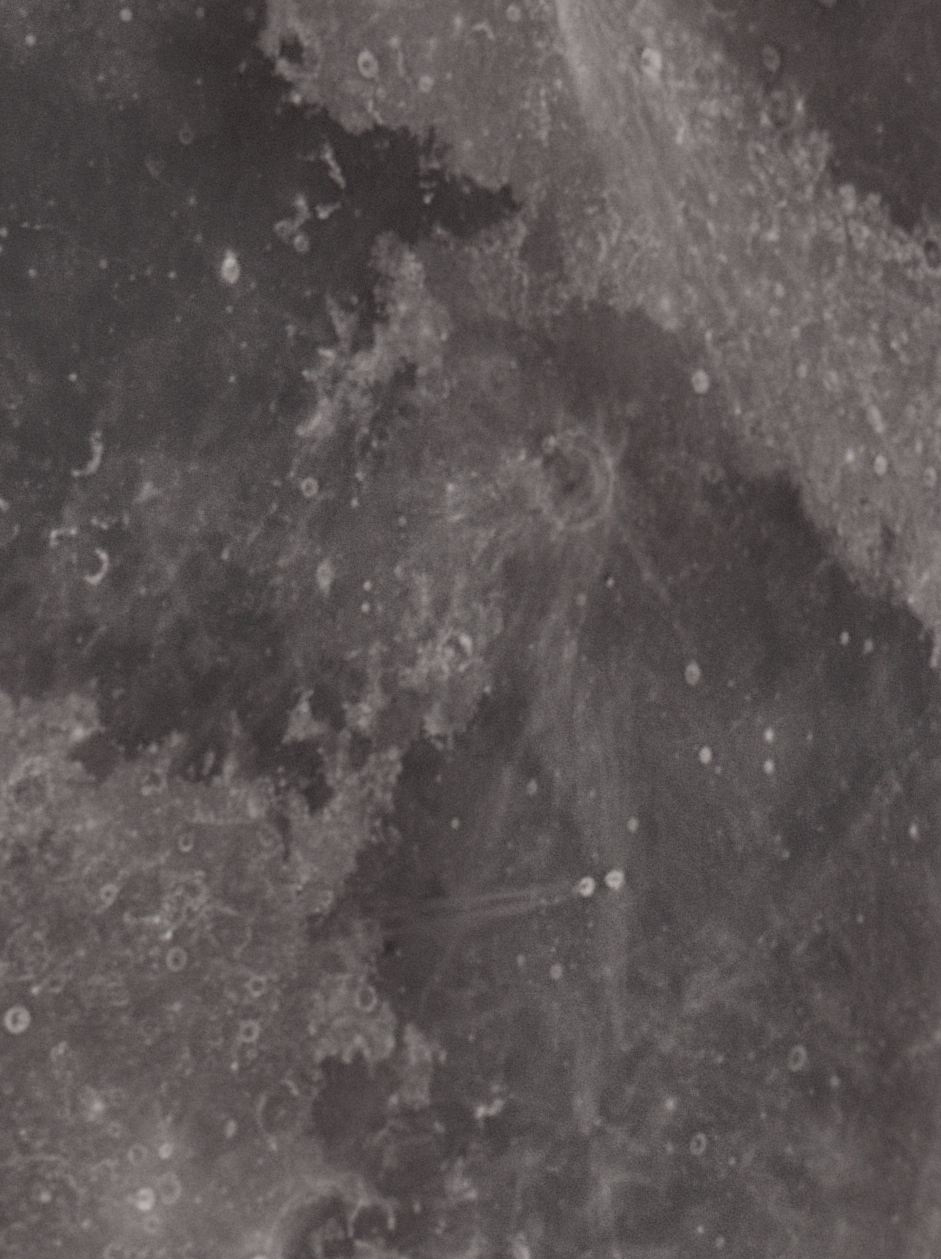 This image shows the border region between Mare Tranquilitatis and Mare Fecundatis. Illustrates the two forms of terrain on the lunar surface, the smooth maria, surrounded by heavily cratered highlands.