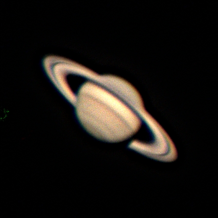 Saturn, with its majestic ring system. Cloud bands in the upper atmosphere of the planet itself can be seen, as well as the Cassini Division in the ring system.