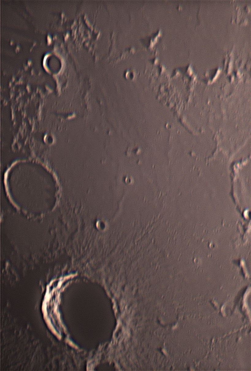 A close-up of part of Mare Nubium (Sea of Clouds) in the southeast quadrant of the Moon. The large crater is Bullialdus and above that is the lava-flooded crater Lubiniezky 